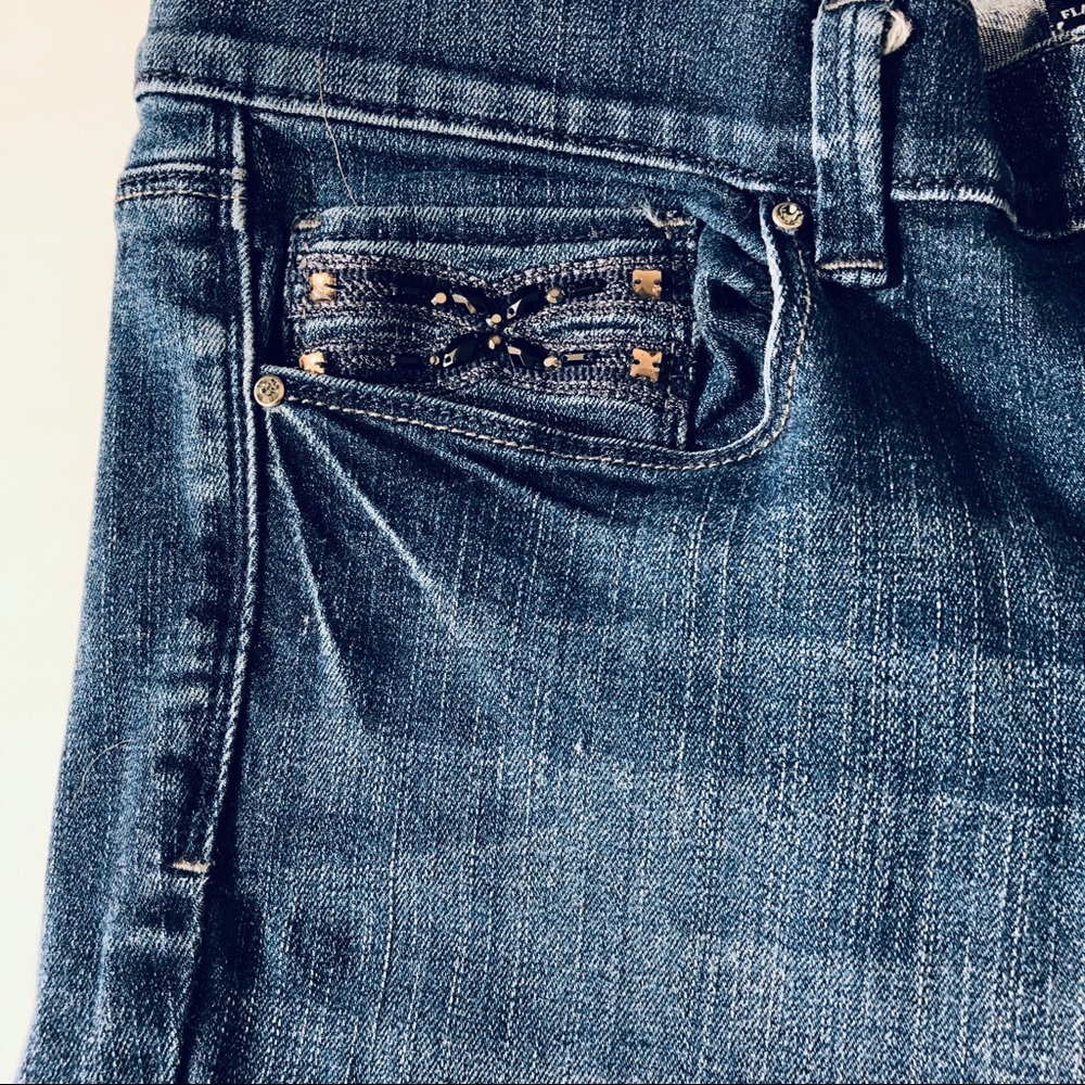 WHBM Flare Leg Mid-Rise Blue Jeans.